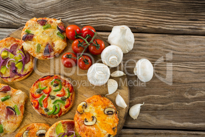 Various pizza with tomatoes and garlics