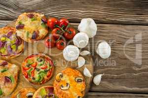 Various pizza with tomatoes and garlics