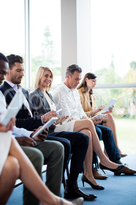 Business executives using digital tablet