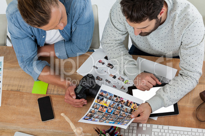 Photographers working together at desk