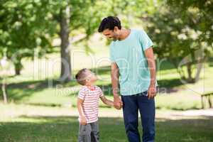 Father and son enjoying together in park