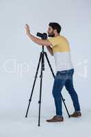 Photographer clicking picture using digital camera