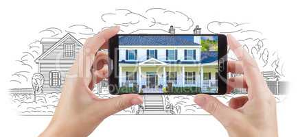Hands Holding Smart Phone Displaying Home Photo of Drawing Behin