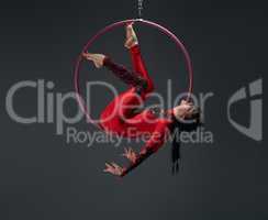 Young slim gymnast with red hoop artistic portrait