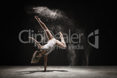 Graceful blonde dancing in white dust color