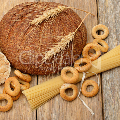 bread, pasta and pastries on a wooden surface