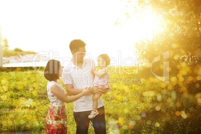 Family having fun at outdoor sunset