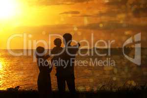 Silhouette of family in outdoor sunset