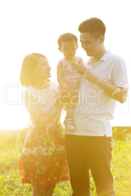 Family outdoor portrait in sunset