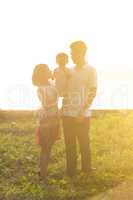 Beautiful family outdoor portrait in sunset