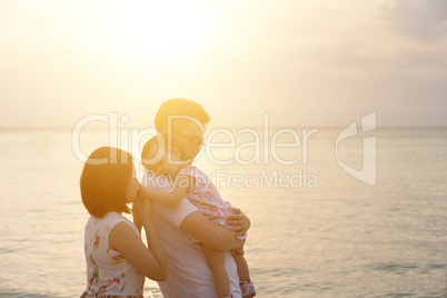 Family enjoying summer holiday at beach