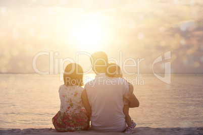 Family enjoying sunset view at seaside