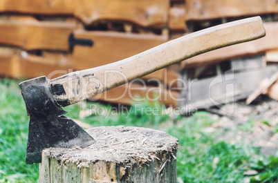 Axe in a log