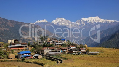 Village Sikle and snow capped Manaslu