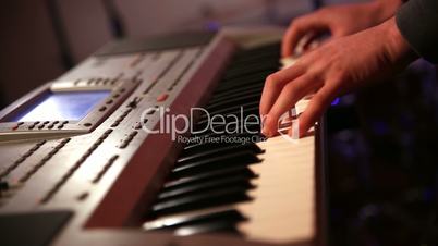 Man playing synthesizer keyboard