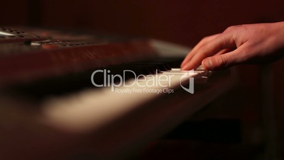 Musician hands on piano keyboard