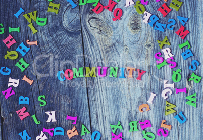 Colorful wooden letters on a gray old wooden background