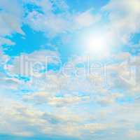 Sun in blue sky and white clouds.