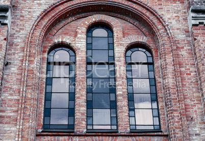 Window with stained glass windows in a brick building