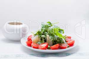 Salad with arugula, tomatoes