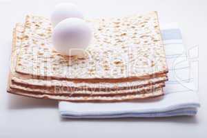 Jewish celebration passover with matza and egg.