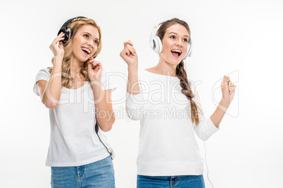 Smiling friends in headphones
