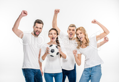 Cheerful friends with soccer ball