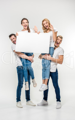 Friends holding blank card