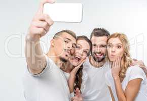 Happy friends taking selfie