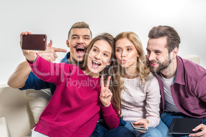 Happy friends taking selfie