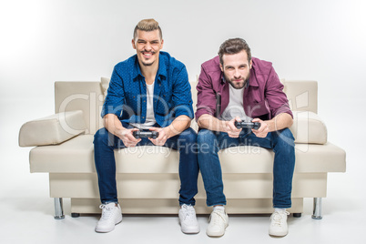 Friends playing with joysticks