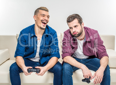 Friends playing with joysticks