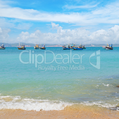 beautiful seascape with fishing boats on the water
