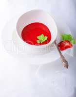 Fresh Strawberry soup with mint on white background