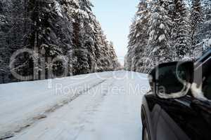 Passenger car moving on winter road