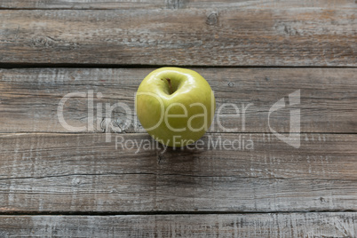 Orcanic yellow apple on wooden boards background. Autumn concept
