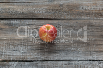 Orcanic red apple on wooden boards background. Autumn concept