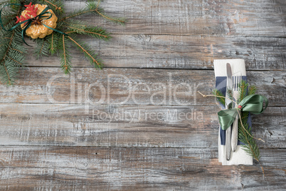 Christmas table place setting with christmas tree branches spoon
