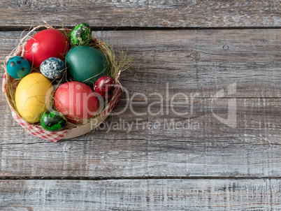 Easter Composition with chicken and quail eggs on the Warm Woode