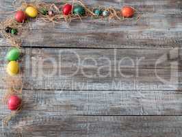 Easter Composition with chicken eggs on the warm wooden wackgrou