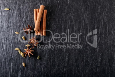 Winter spices on a stone surface