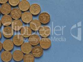 Pound coins, United Kingdom over blue with copy space