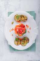 Rice timbale with fried zucchini, peppers, carrots