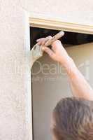 Professional Painter Cutting In With Brush to Paint House Door F