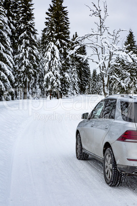 Car in snow-covered winter scenery