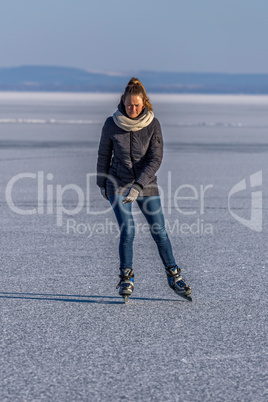 Young girl skating on Lake Balaton in Hungary