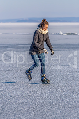 Young girl skating on Lake Balaton in Hungary