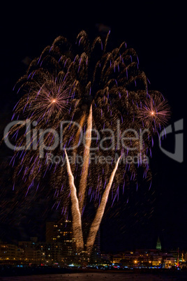 Interesting fireworks over the small town in Spain, Palamos