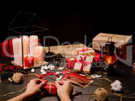 Female hands packing gift