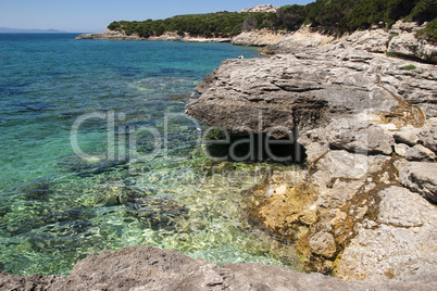 Rocks and turquoise blue water at Capo Testa